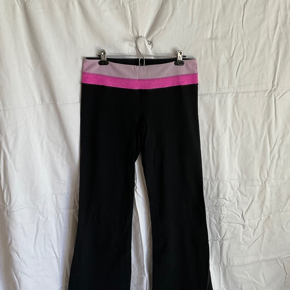 Lululemon Astro workout pants with pink waistband trim. Size 12